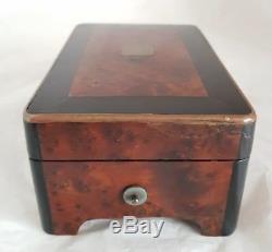 A French late C19th cylindrical music box. Veneered in Burr Amboyna & Ebany