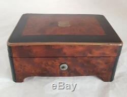 A French late C19th cylindrical music box. Veneered in Burr Amboyna & Ebany