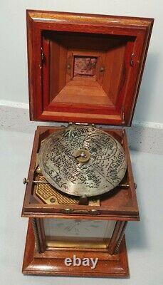 A German Mahogany and Gilt Brass Mounted Mantel Clock and Harmonie Symphonion