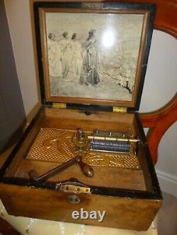 Antique Polyphon music box with 18 discs in working order case needs attention