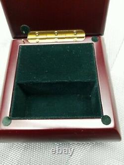 Delightful Warm Tone Wood Music Jewelry box With Metal Heart Inlay lined green